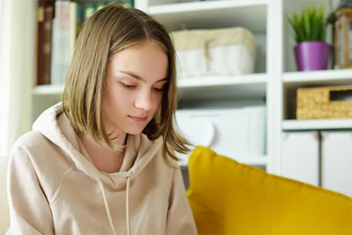 Autism girl on sofa