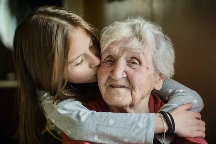 grandmother and grandaughter hug