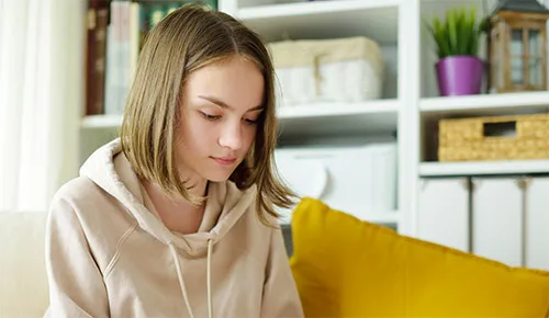 Autism girl on sofa